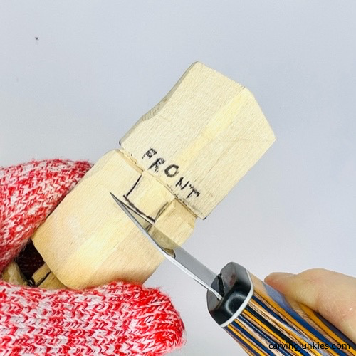 Carving nose on gnome