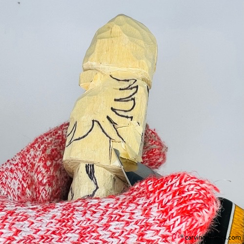 Slicing cut on wooden gnome