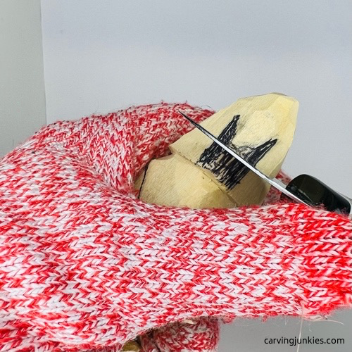 Adding tassel to wooden gnome hat