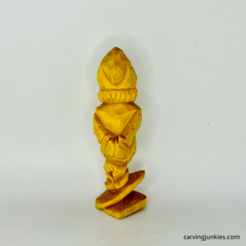 Back view of wooden gnome before painting