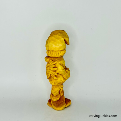 Left view of unpainted wooden gnome