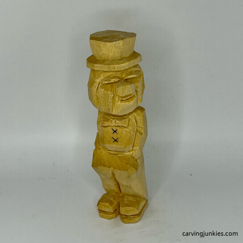 Adding buttons to little man caricature carving