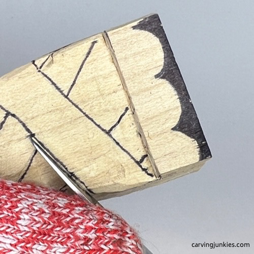 Making stop cut on wooden pie carving